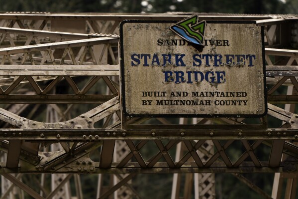 A sign is seen for the Stark Street Bridge as construction continues on the bridge on Thursday, Feb. 6, 2025, in Troutdale, Ore. (AP Photo/Jenny Kane)